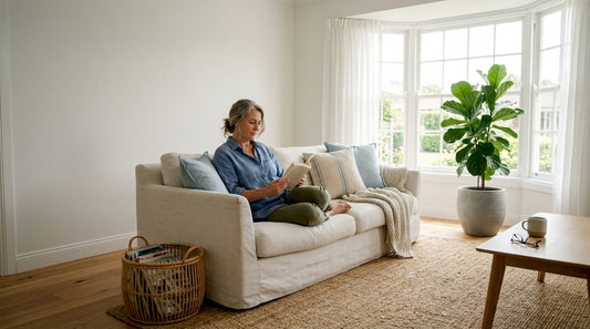 Woman reading in coastal style living room