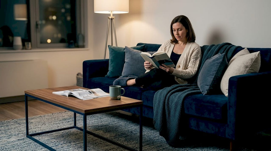 Person reading in a cozy, layered living room
