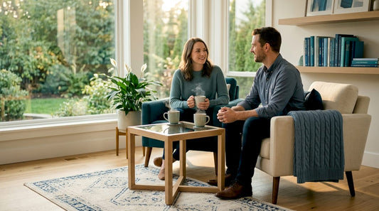 Couple with accent tables in sunny living room