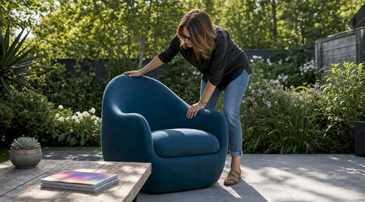 Woman adjusting statement armchair in living room